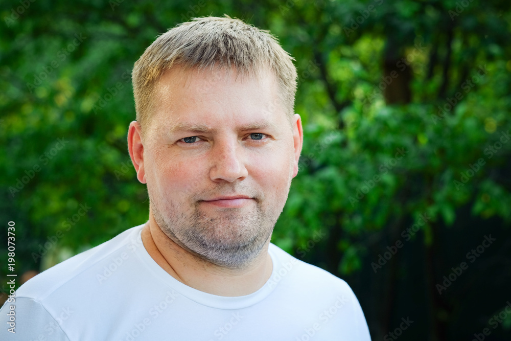 Portrait of handsome friendly middle-aged man smiling Portrait of handsome friendly middle-aged man smiling