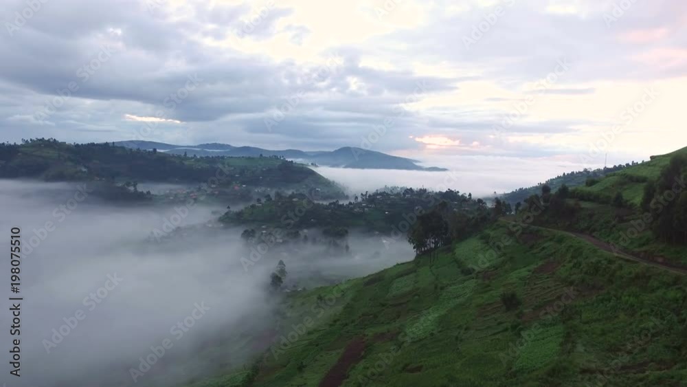 Aerial view of villages on hills covered by clouds Aerial view of villages on hills covered by clouds