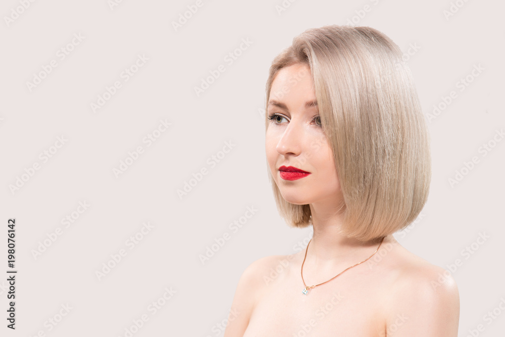 Portrait of beautiful female model on grey background Portrait of beautiful female model on grey background
