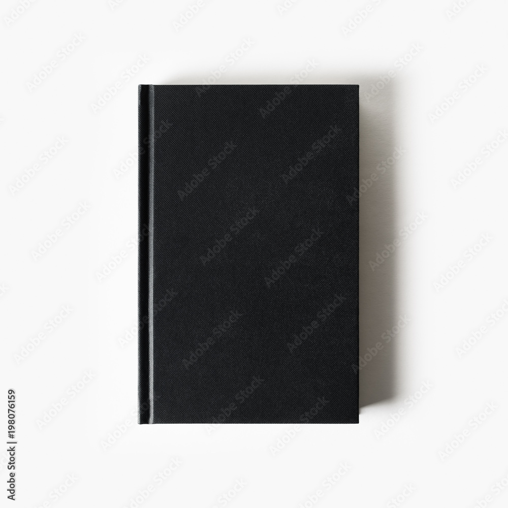 Blank black booklet. Vertical book cover on white paper background. Flat lay. Blank black booklet. Vertical book cover on white paper background. Flat lay.