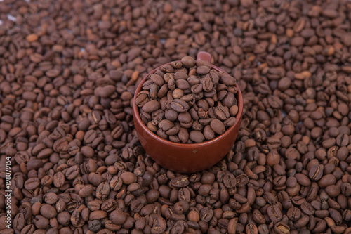 Cup of coffee on the coffee beans background