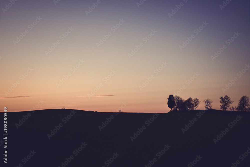 Silhouette of a rural landscape at sunet