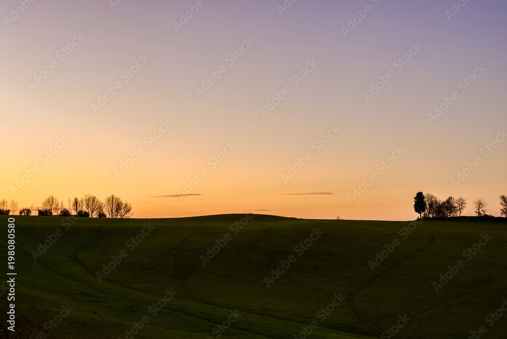 Silhouette of a rural landscape at sunet