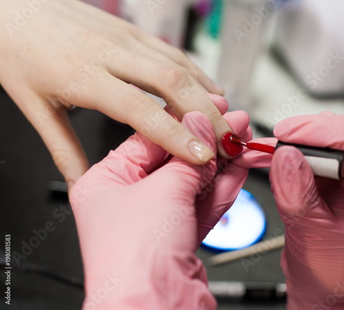 Cosmetics. Hands  nails manicure  paint   brushes  red