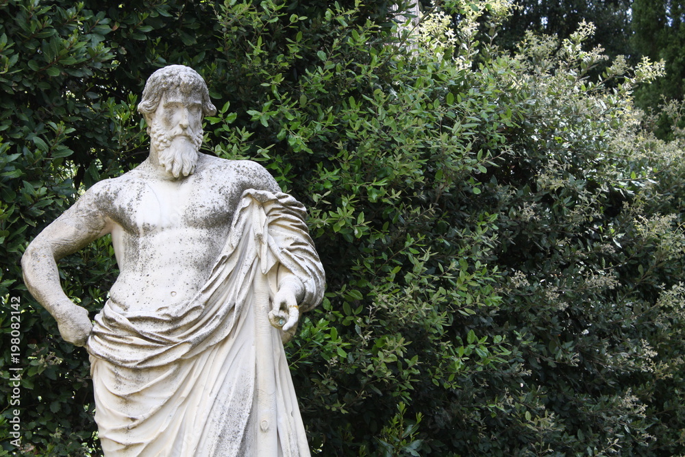 Ancient man sculpture in the Boboli gardens in Florence, Italy
