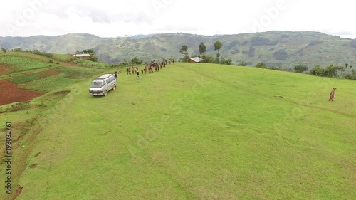 Aerial view of African people standing on a field  photo