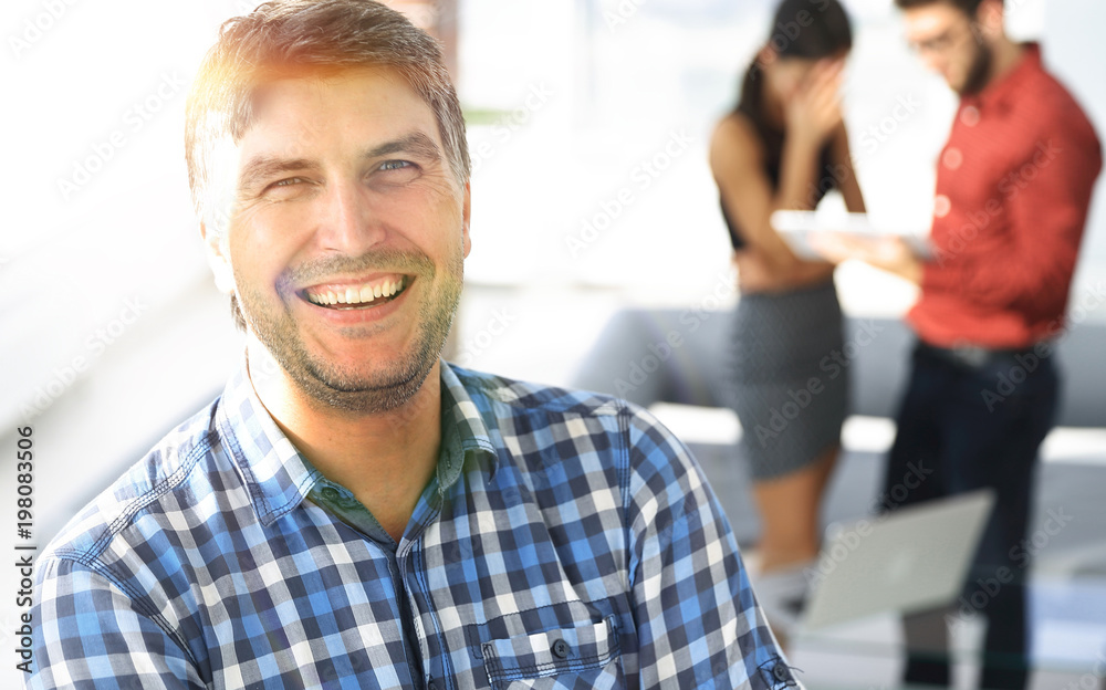 Casual businessman with arms crossed standing in the office Casual businessman with arms crossed standing in the office