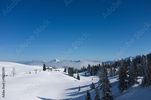 Snow covered winter landscape on mount Dobratsch in Villach, Austria