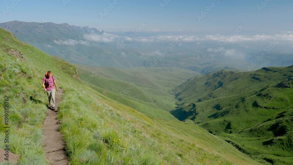 Backpacking on mountain trail on exploring adventure in South Africa Backpacking on mountain trail on exploring adventure in South Africa