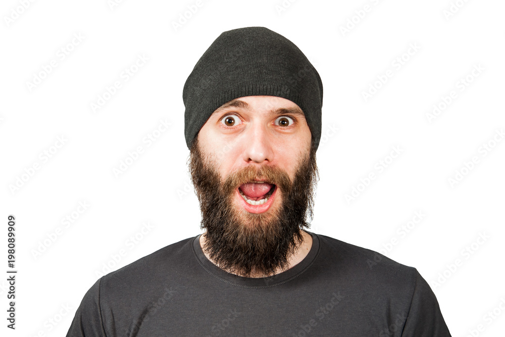 Young bearded guy in hat, smiles and open mouth. Isolated on white.