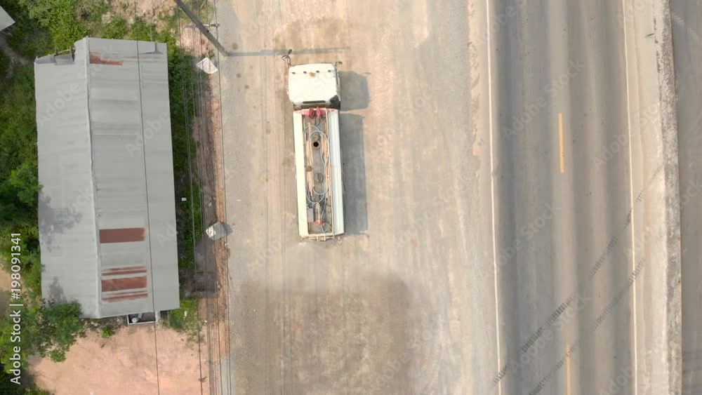 Water truck with spray system working as dust control and suppression at road construction site Water truck with spray system working as dust control and suppression at road construction site