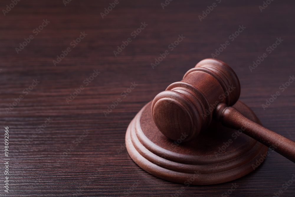 Judge gavel on wooden table