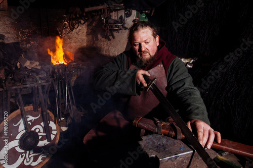 Viking sword handles sword rack reenactment forge smith warrior weapon outfit ax shield skin fire hearth one man