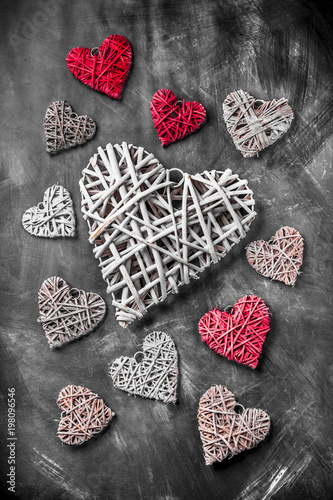 Valentine's day wooden and knitted hearts background on skettch board arrangement in studio photo