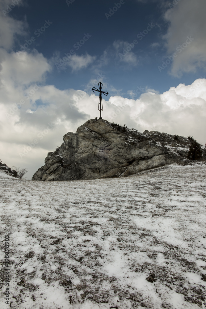 Fototapeta premium A hill called Maly Giewont with a characteristic cross in Olsztyn near Czestochowad