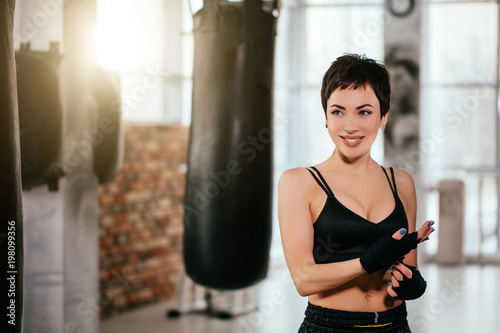 Bild auf Leinwand close up portrait of happy female with short haircut in workout