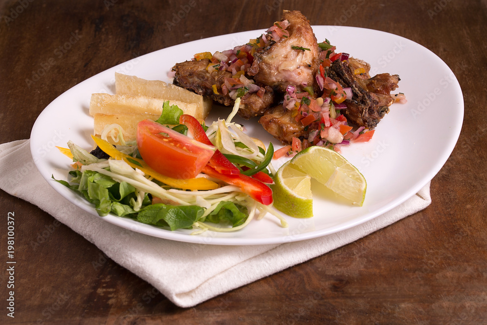 Frango a Passarinho, fried chicken marinated with garlic Frango a Passarinho, fried chicken marinated with garlic