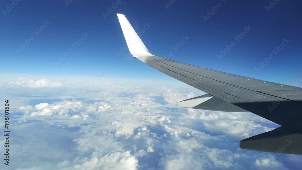 View of Sky with clouds from the plane passeger seat window View of Sky with clouds from the plane passeger seat window
