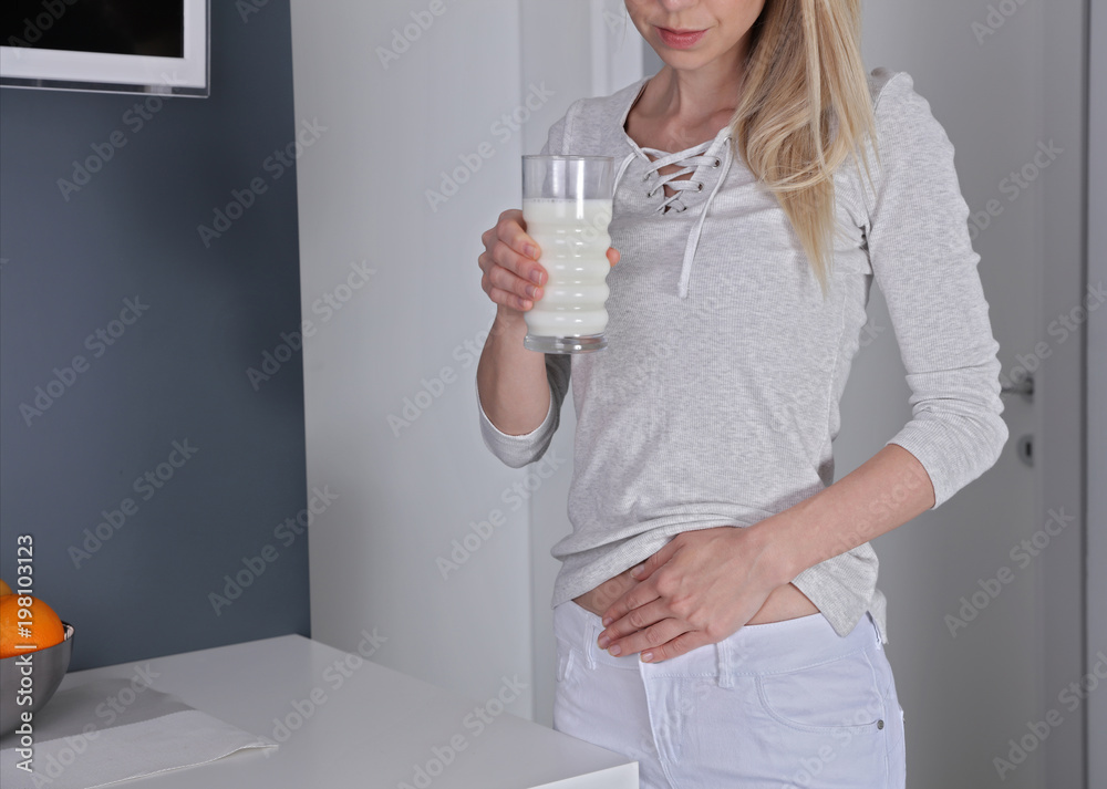 Dairy Intolerant person. Woman with stomach pain after drinking milk. Lactose intolerance, health care Dairy Intolerant person. Woman with stomach pain after drinking milk. Lactose intolerance, health care