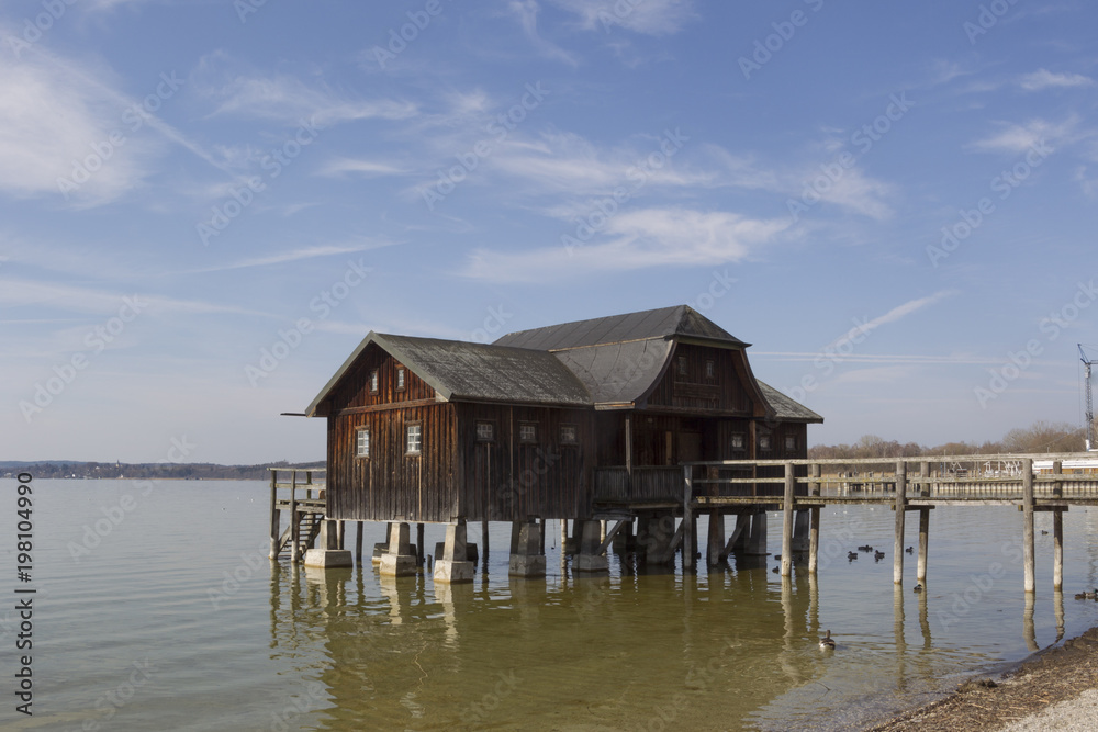 old wooden boathouse with footbridge old wooden boathouse with footbridge