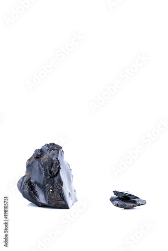 Pieces of black resins isolated on a white background, also named how asphalt ot bitumen