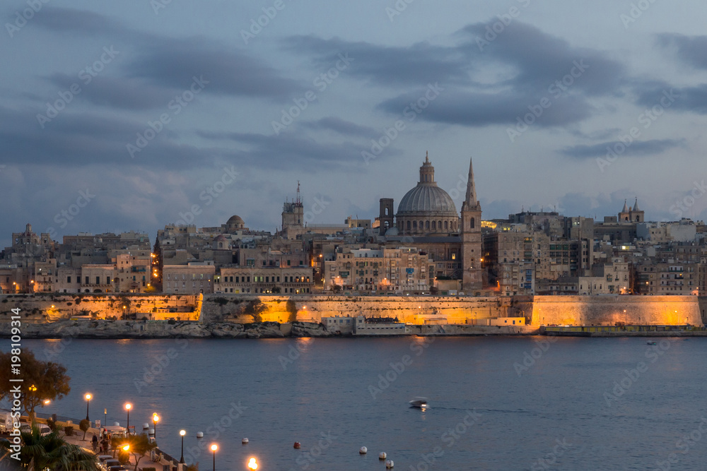Malta - Lights of Valletta from Sliema at dusk.