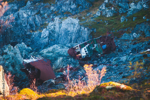 Shipwreck against the rocks along the norwegian fjord in Northern Norway