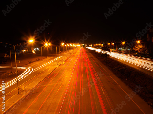 moving car with blur light through city at night