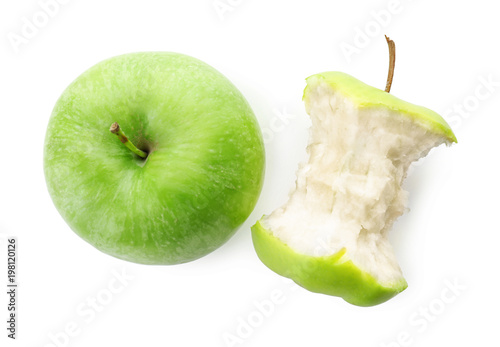 Half-eaten and whole green apple isolated on white