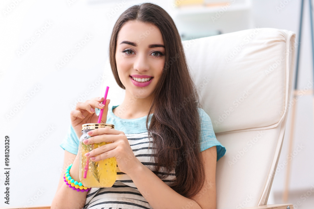 Young woman with tasty refreshing lemonade indoors Young woman with tasty refreshing lemonade indoors