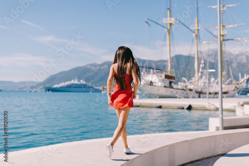 woman in summer dress travelling
