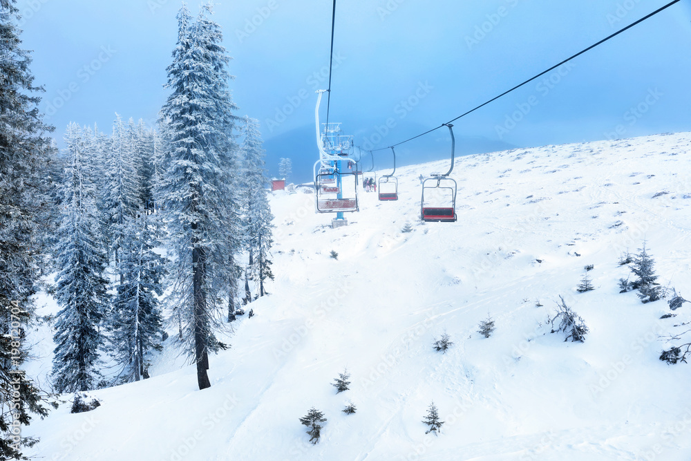 Ski lift at mountain resort. Winter vacation Ski lift at mountain resort. Winter vacation