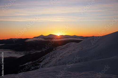 Beautiful landscape with snowy mountains in winter morning © Africa Studio