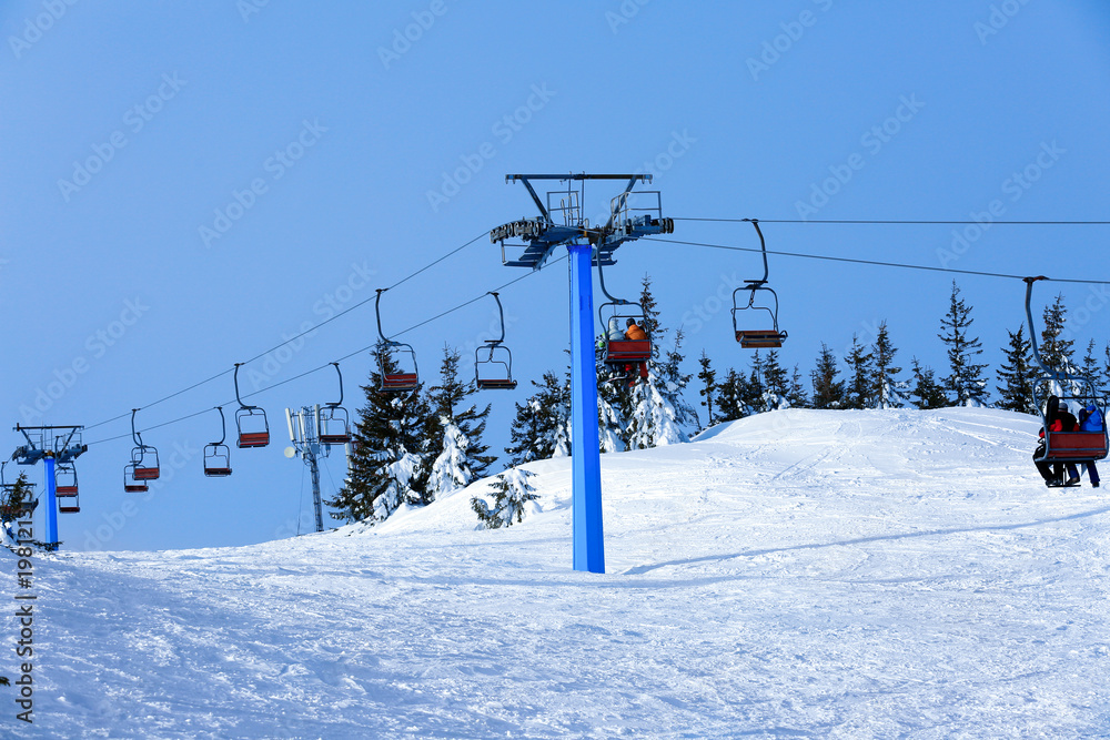 Ski lift at snowy resort. Winter vacation Ski lift at snowy resort. Winter vacation