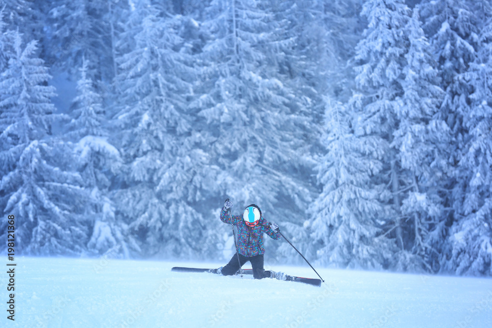 Sporty woman after fall on ski piste at snowy resort. Winter vacation Sporty woman after fall on ski piste at snowy resort. Winter vacation