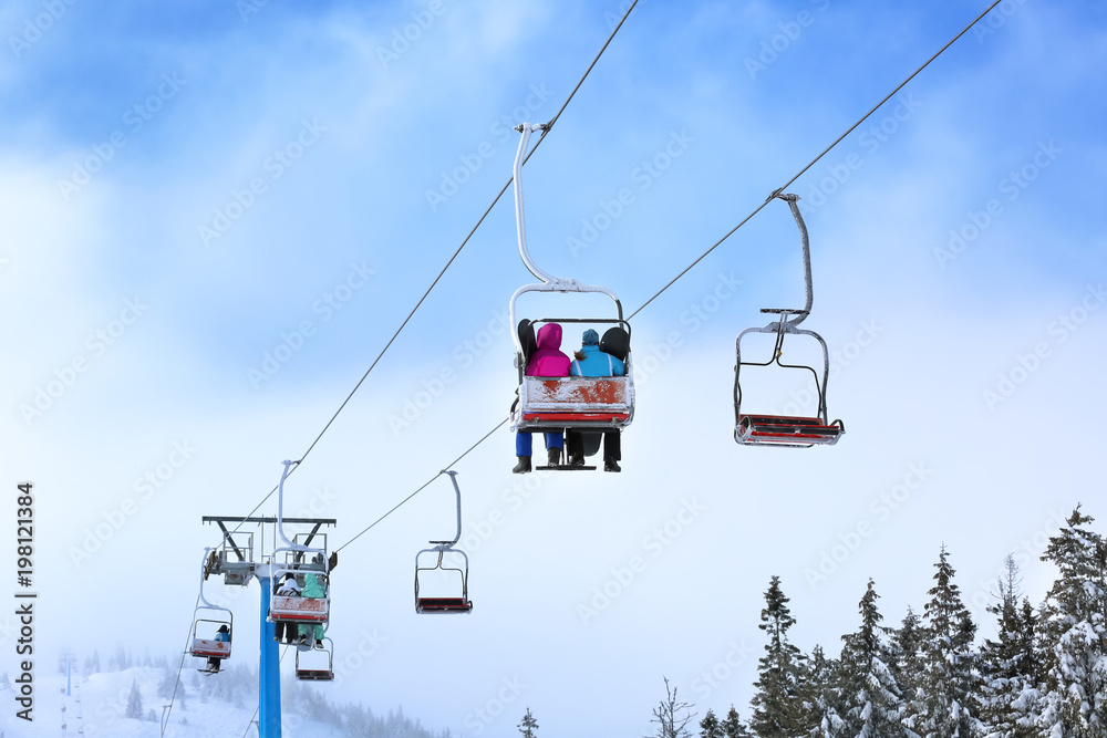 Ski lift at mountain resort. Winter vacation Ski lift at mountain resort. Winter vacation