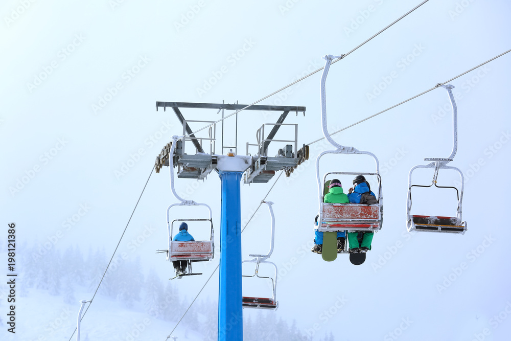 Ski lift at mountain resort. Winter vacation Ski lift at mountain resort. Winter vacation