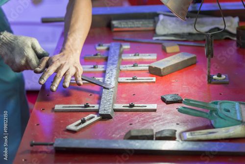 Фотография The craftsman making the scraping process for make flatness on the slide-way of grinding machine