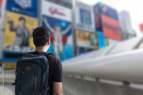 Young man Asian Happy tourists  traveling backpacker Tourist traveler on background view © onephoto