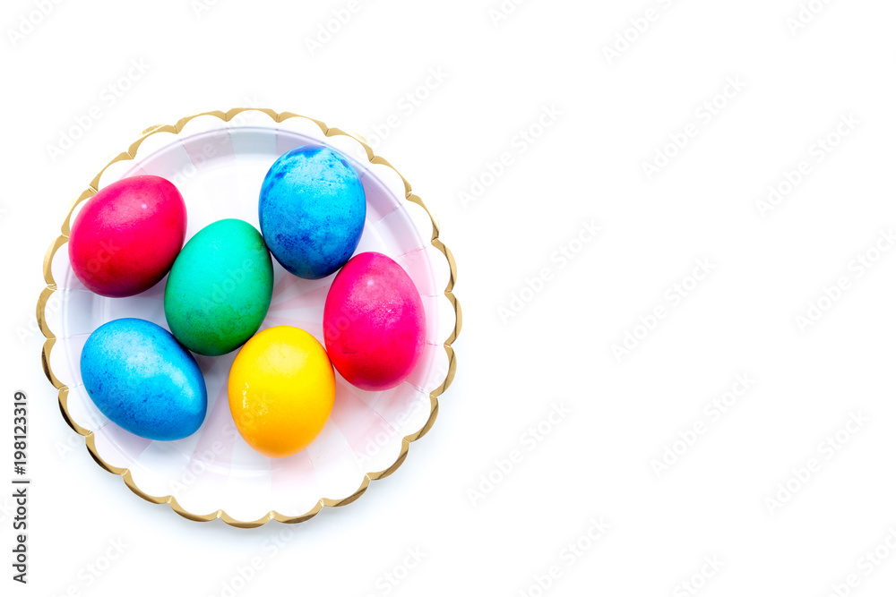 Colorful easter eggs on plate on white background top view mockup Colorful easter eggs on plate on white background top view mockup