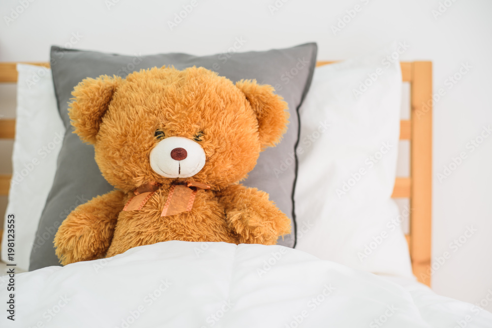 Teddy bear on the bed