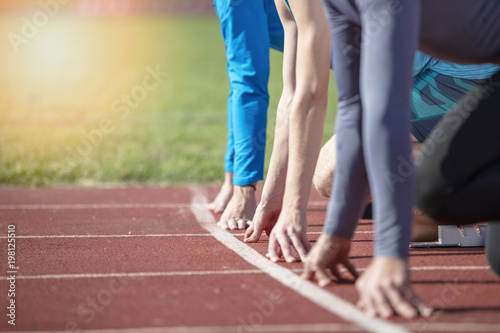 Fotografija Athletes at the sprint start line in track and field