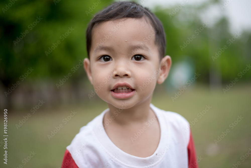 Little happy boy smiling In Park Little happy boy smiling In Park