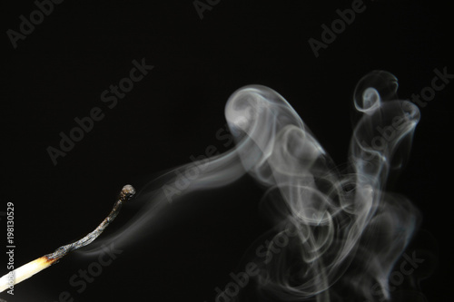 extinguished match with smoke