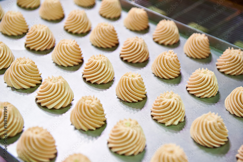 Confectionery cream on baking sheet Confectionery cream on baking sheet