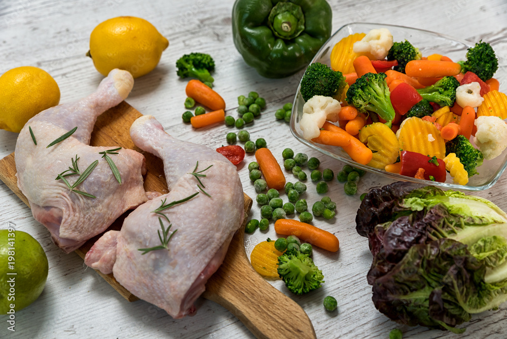 raw chicken legs from vegetables to a wooden table, preparing chicken legs for vegetables, Recipe - ingredients