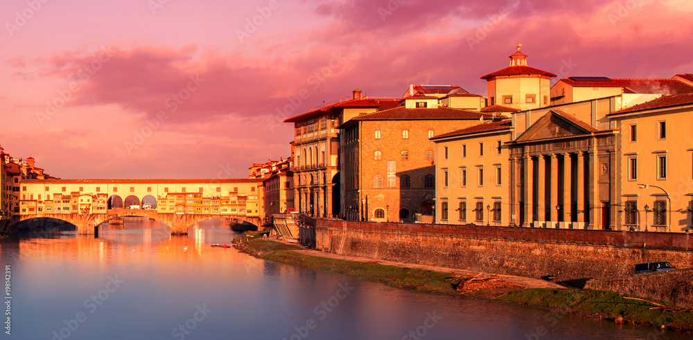 Beautiful Sunset view of Ponte Vecchio over Arno River in Florence, Italy. Florence is a popular tourist destination of Europe. .