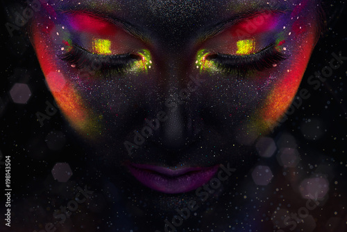 Bright neon fashion makeup, creative body art on the theme of space and stars. Young woman portrait Fashion/ Beauty / Makeup