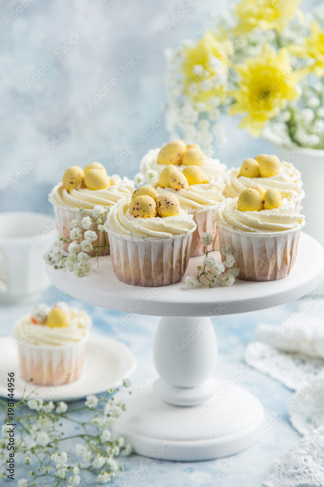 Easter cupcakes decorated with cream cheese frosting and candy eggs Easter cupcakes decorated with cream cheese frosting and candy eggs