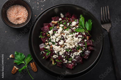 beetroot, feta cheese and walnut salad, black background